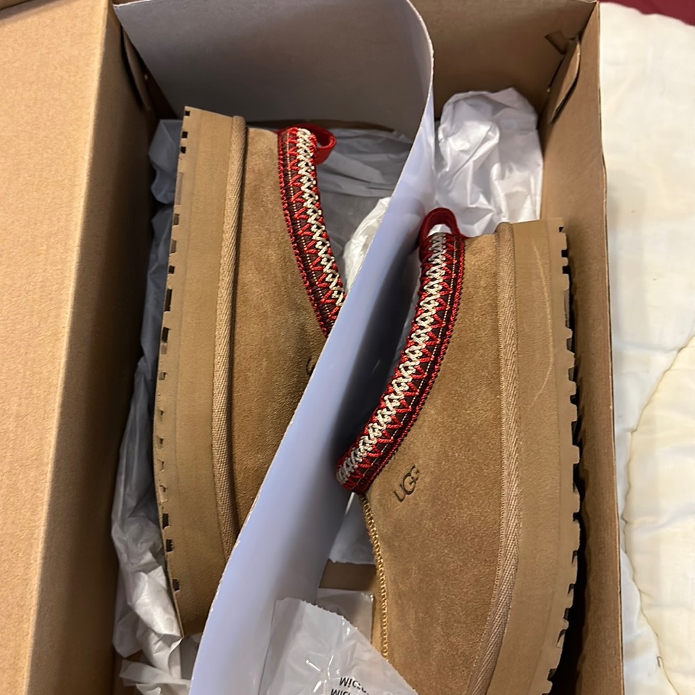 Brand new pair of kids Ugg tazz